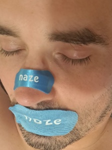Close up of Naze strip and mouth tape being worn