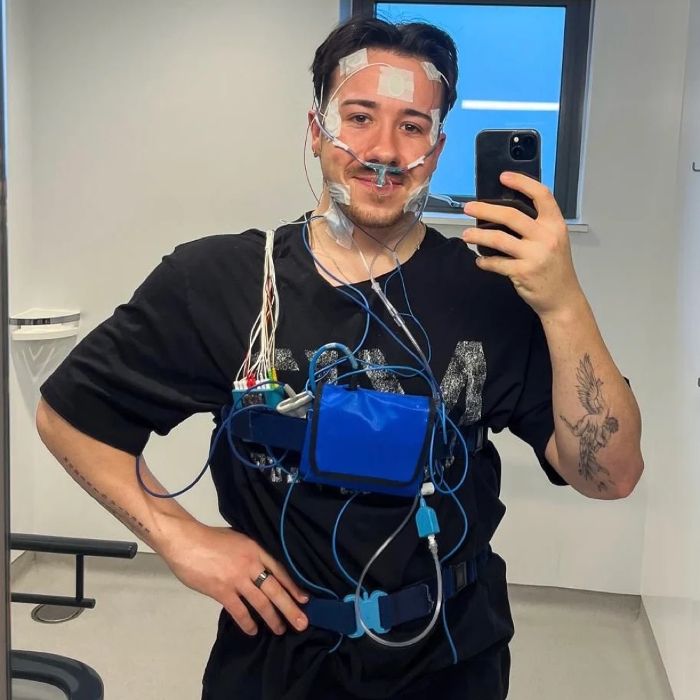 Adam wearing sleep apnea test equipment in 2023